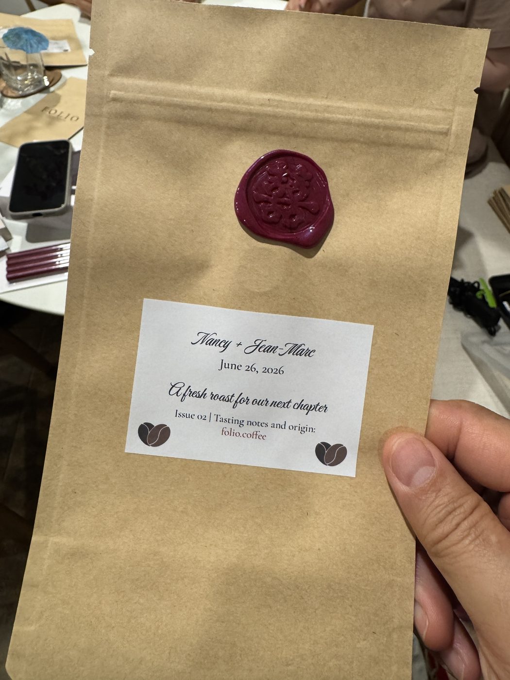 A Folio coffee wedding favor bag, wax seal and hand-lettered label