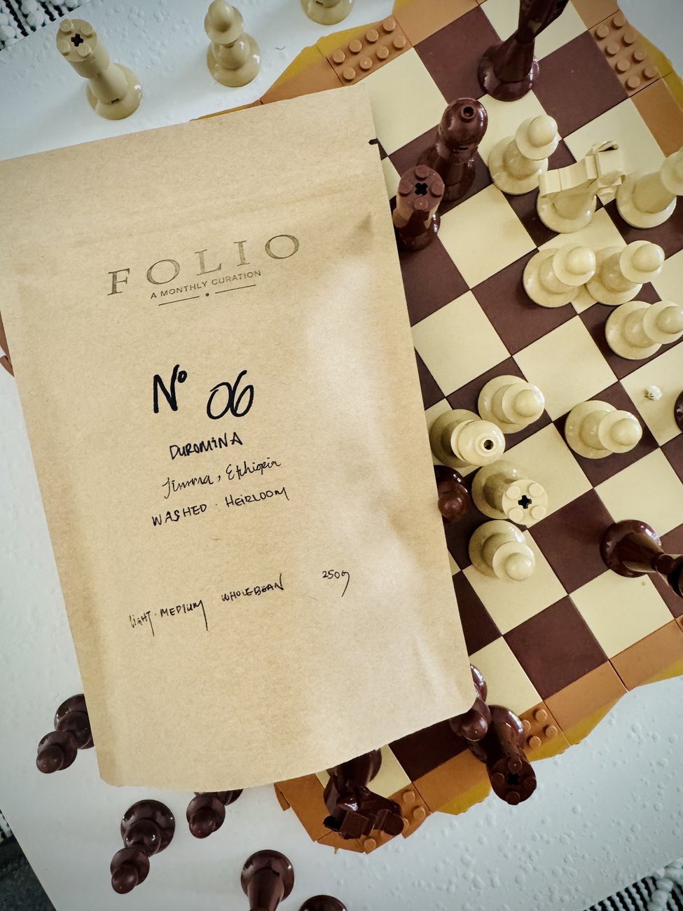 A Folio Nº 06 bag, hand-lettered Duromina, Jimma, Ethiopia, on a chessboard