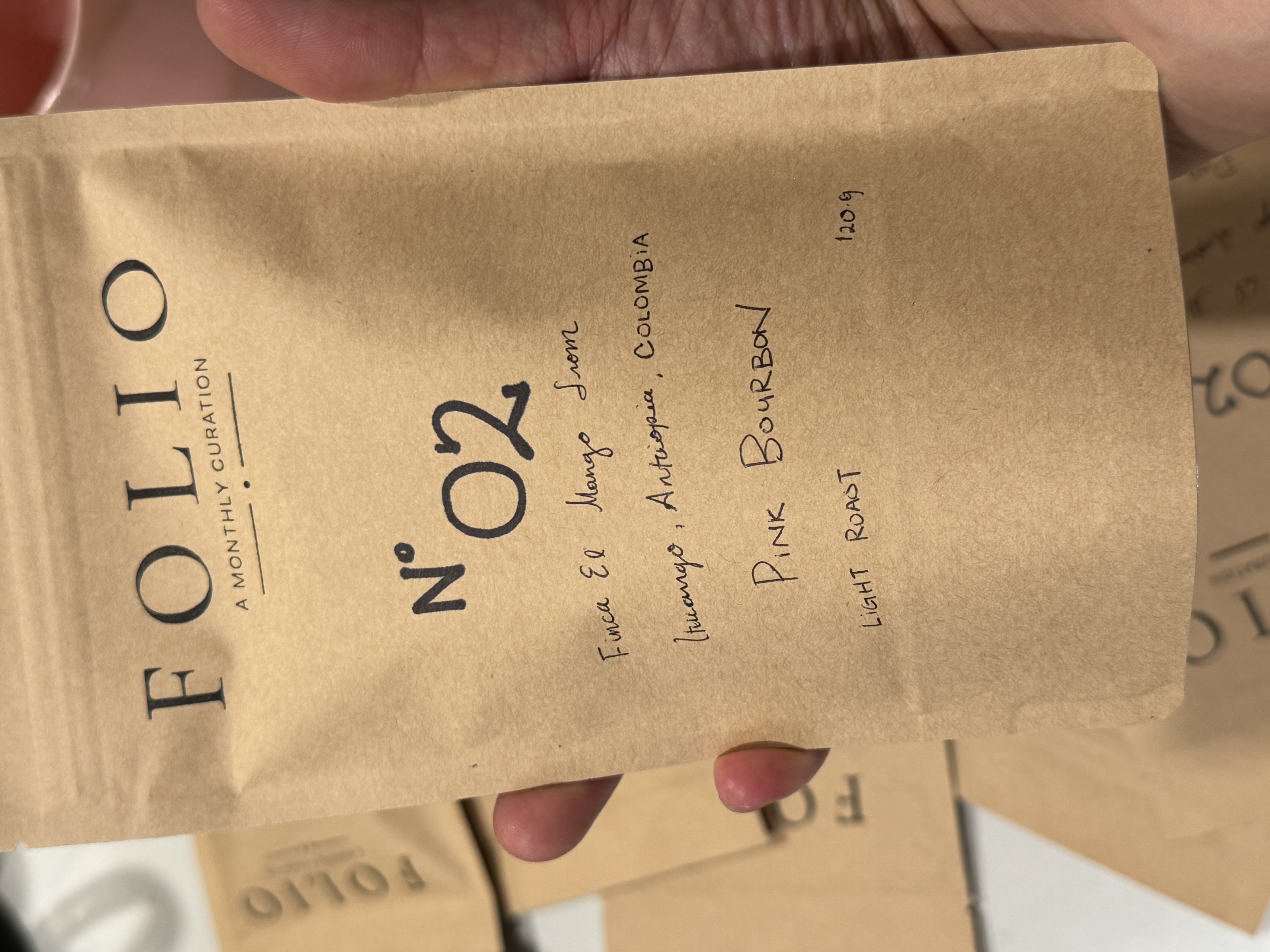 A Folio Nº 02 bag, hand-lettered on kraft paper.